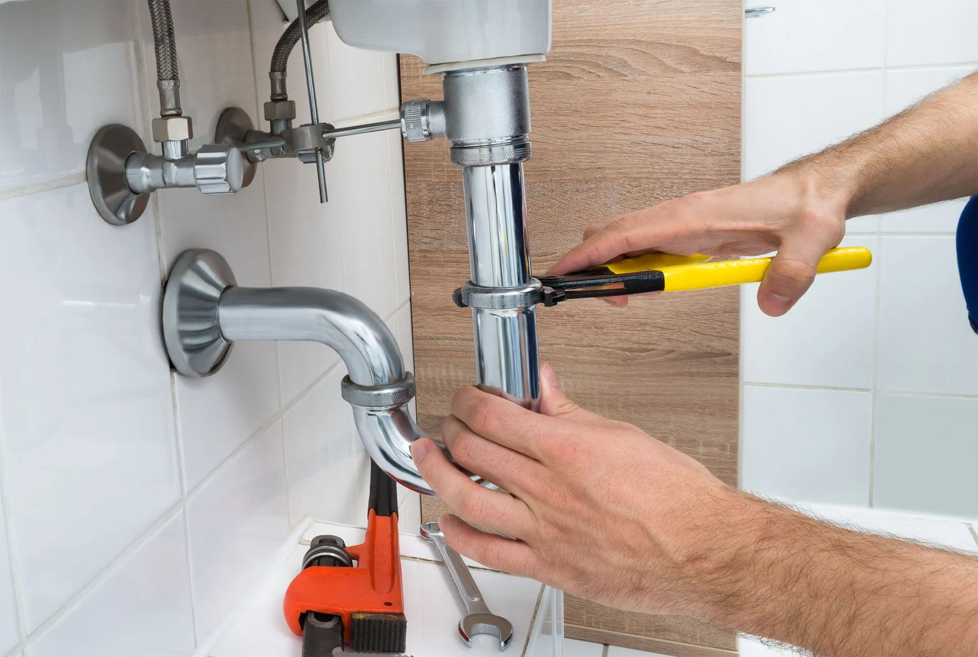 plumber fixing sink