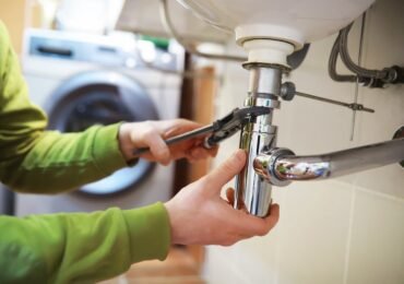 plumber fixing sink